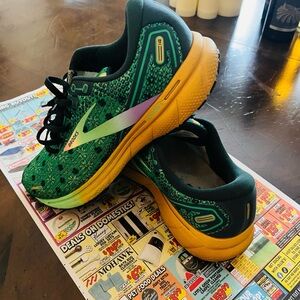 Brooks Green and Orange Sneakers with clover, rainbow and pot o’ gold design.